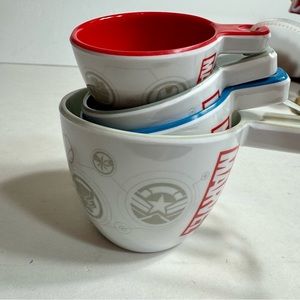 NWT. Disney Marvel Kitchen Collection 4 Measuring Cups 2/3,1/3,1/4,1/8 Cup Sizes